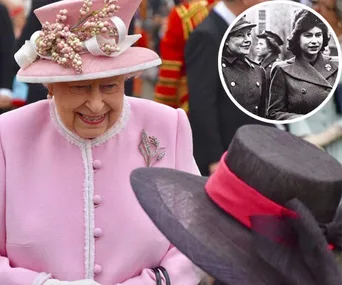 Queen in pink outfit and hat greets someone; inset shows her in military attire from a past era.