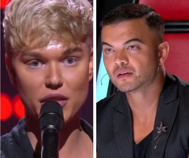 A singer performs on stage while a judge listens intently on a talent show.