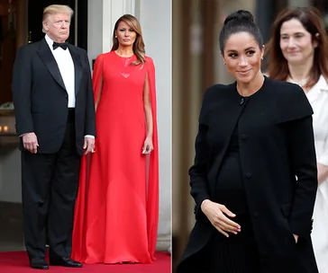 Two women in elegant dresses; one in red, the other in black, with a man in a tuxedo standing next to the woman in red.