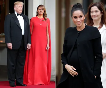 Two women in elegant dresses; one in red, the other in black, with a man in a tuxedo standing next to the woman in red.