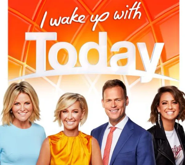 "Four TV hosts pose together under 'I wake up with Today' text on orange background."