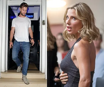Two individuals, one in a white t-shirt and jeans, the other in a black dress, possibly at a social event.