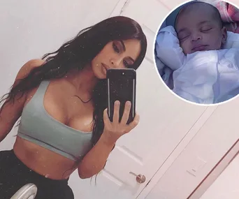 Young woman taking a mirror selfie with a phone; inset shows a sleeping baby in white clothing.