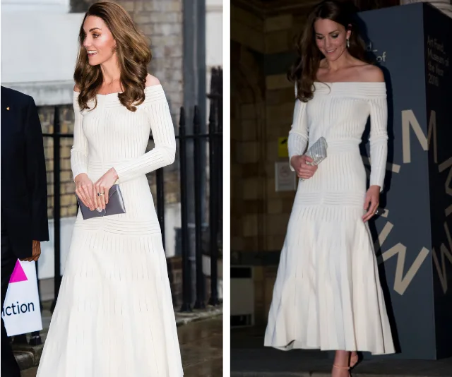 Kate in an elegant off-shoulder white Barbara Casasola dress, holding a clutch and smiling at an event.
