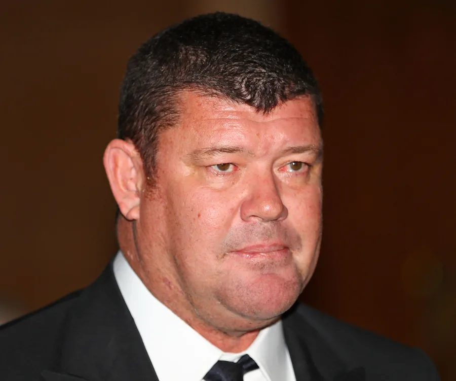 A man in a tuxedo with short hair at an event.