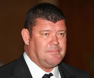 A man in a tuxedo with short hair at an event.