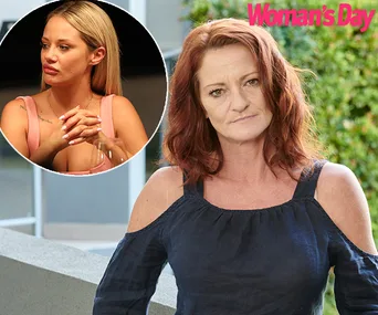 Woman with red hair outdoors, inset shows another woman with blonde hair, text "Woman's Day" in top right corner.
