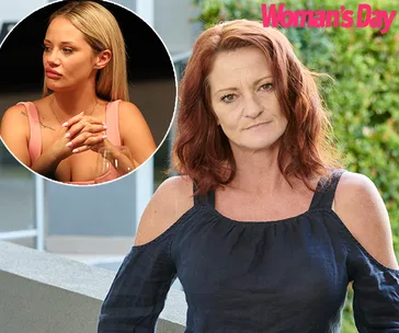 Woman with red hair outdoors, inset shows another woman with blonde hair, text "Woman's Day" in top right corner.