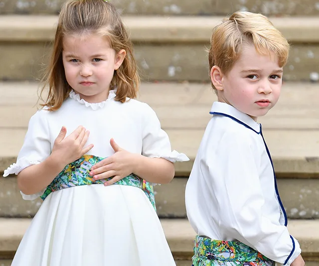 Children in formal attire on steps at a wedding.