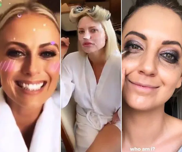 Three women in robes getting ready for an event, with playful makeup and hair styling.