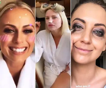 Three women in robes getting ready for an event, with playful makeup and hair styling.
