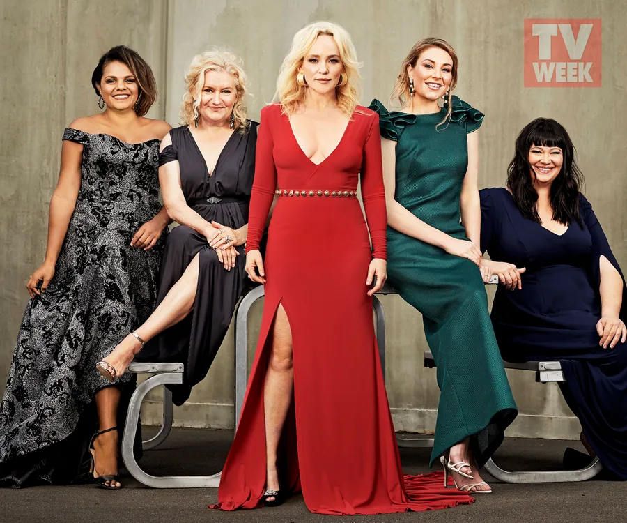 Cast members of "Wentworth" in formal attire at the 2019 Logie Awards, posing against a concrete wall with TV Week logo.