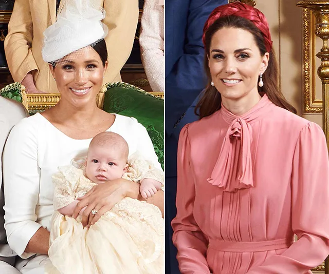 Meghan Markle holding a baby in a christening gown; Kate Middleton in a pink dress with a red headband, both smiling.