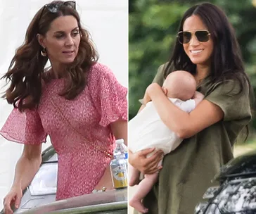 Two women outdoors, one in a pink dress, the other in green, holding a baby and smiling, both in a casual setting.