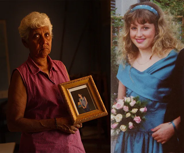 Elderly woman holding a framed photo beside an image of a young woman in a blue dress holding flowers.