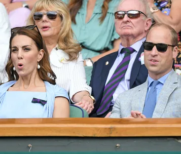 Royals and guests seated at Wimbledon, appearing engaged and wearing summer attire, sunglasses, and expressions of surprise.
