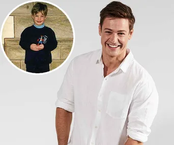 Adult man in a white shirt smiling, with an inset showing a young boy holding a toy against a stone backdrop.