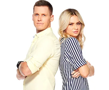 Two individuals standing back to back, arms crossed, one in a yellow shirt and the other in a striped shirt.