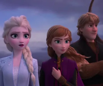 Elsa, Anna, and Kristoff from Frozen look intently into the distance against a cloudy backdrop.