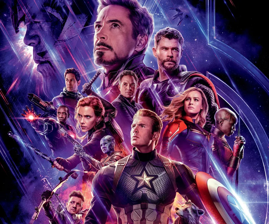 Avengers heroes assemble with Thanos' looming face in "Avengers: Endgame" poster, set against cosmic backdrop.