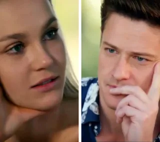 Two people in a thoughtful conversation, one with a hand on their face, the other listening attentively.