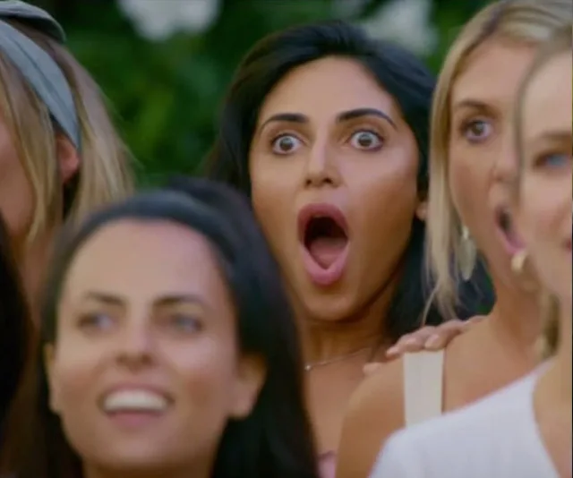 Women look surprised, wide-eyed, and with open mouths in a reaction scene from "The Bachelor" 2019 episode.