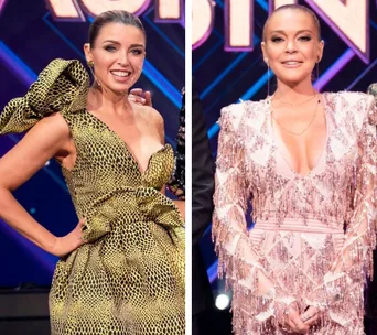 Judges on "The Masked Singer" in stylish dresses, one in leopard print, the other in pink fringe.
