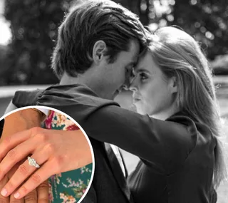 Couple embracing, inset of woman's hand with diamond engagement ring.