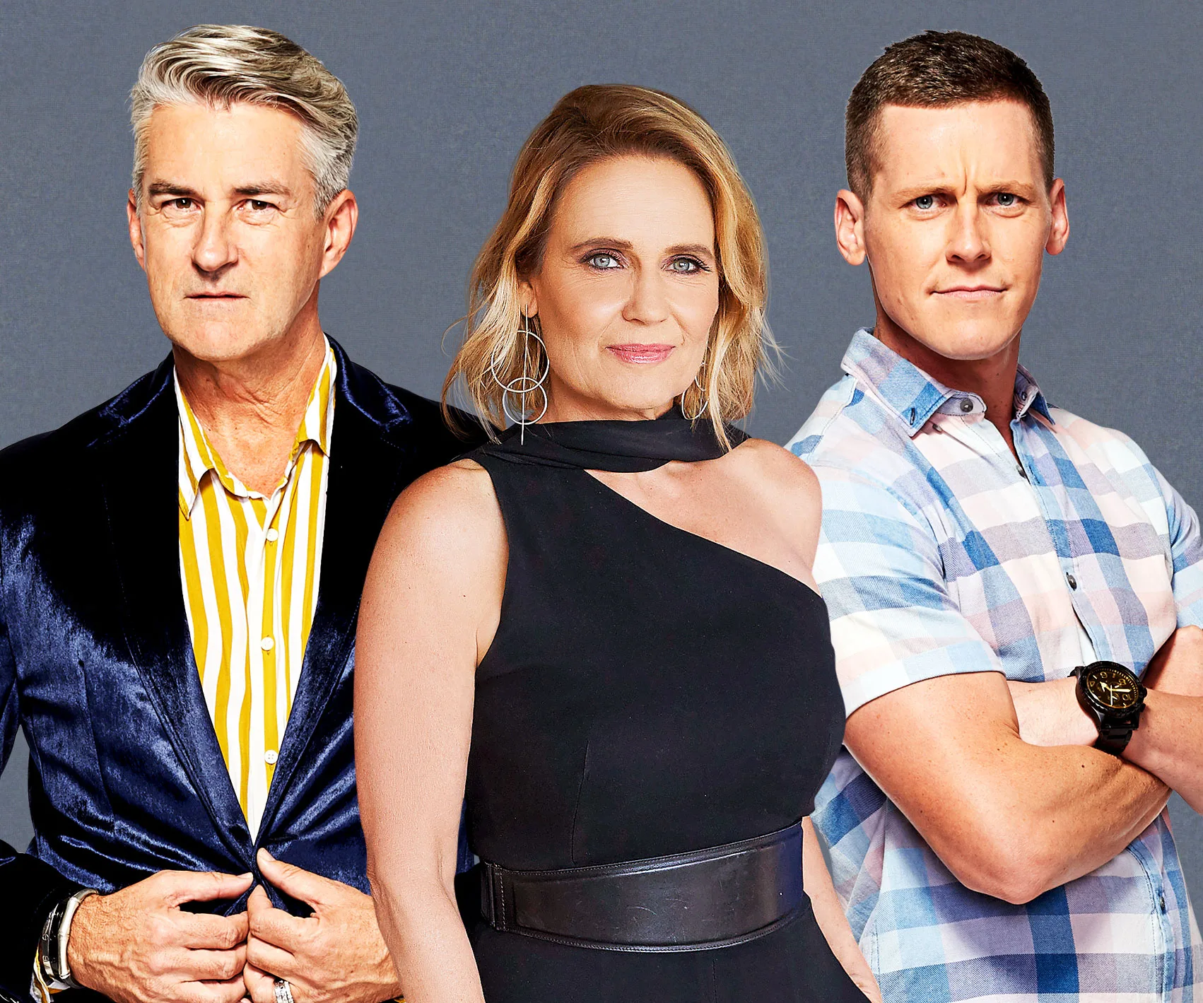 Three individuals posing: a man in a velvet blazer, a woman in a black dress, and a man in a plaid shirt.