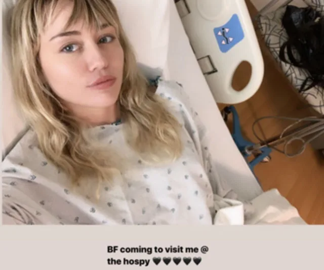 Hospitalized person in gown lying in bed, caption indicates a boyfriend is visiting.