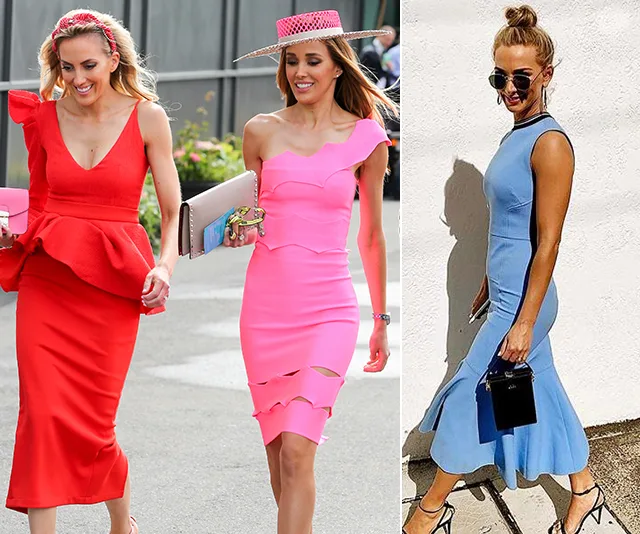 Two women in colorful dresses walk outdoors, one in red and one in pink, while another woman in a blue dress poses by a wall.