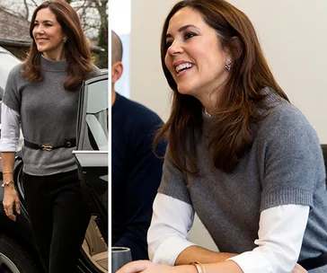 "Person in grey sweater over white shirt, smiling and exiting a car and sitting indoors."