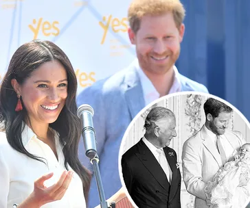Prince Charles and Prince Harry smile at baby Archie in a black and white inset photo; Meghan and Harry are in the main photo.