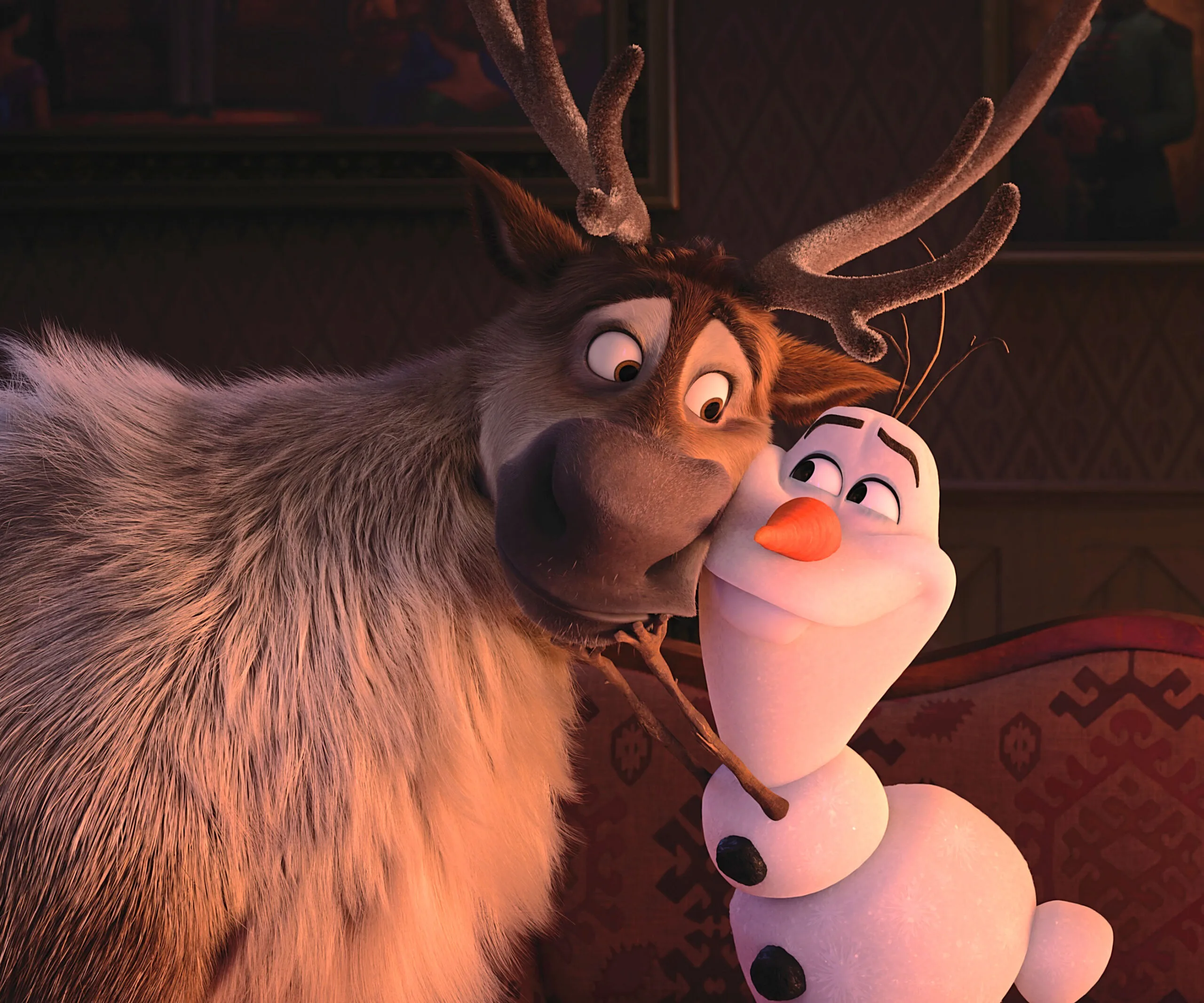 Sven the reindeer affectionately nuzzles Olaf the snowman in a cozy room, showcasing friendship in "Frozen 2."