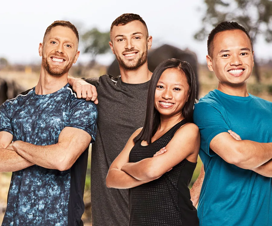 Group photo of four smiling contestants from "The Amazing Race Australia 2019," arms crossed outdoors.