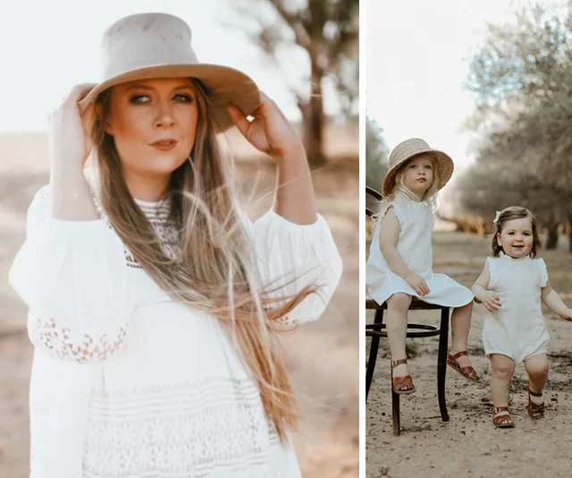 Woman and two children in white outfits and hats outdoors, surrounded by trees.