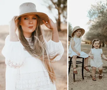 Woman and two children in white outfits and hats outdoors, surrounded by trees.