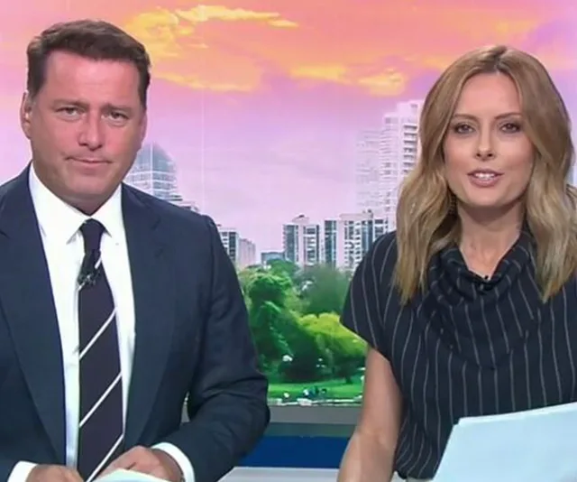 Today Show hosts sitting at the desk with a cityscape background.