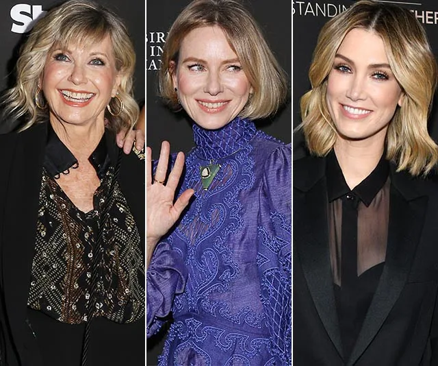 Three women smiling at G'Day USA 2020 event; one waves, all in formal attire.