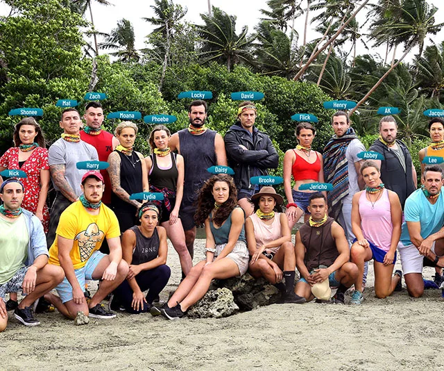 "Group of Survivor Australia All Stars 2020 contestants posed on a beach with trees in the background."