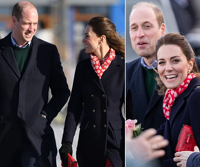 Prince William and Kate Middleton smiling outdoors, wearing coats; Kate with a red polka dot scarf.