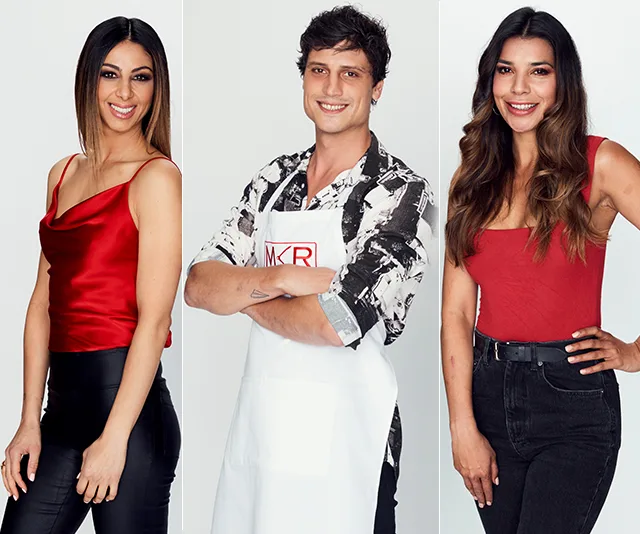 Three individuals posing, two women in red tops, one man in an apron labeled "MKR," smiling at the camera.