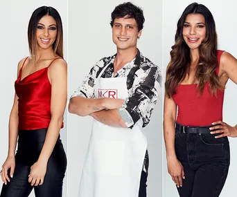 Three individuals posing, two women in red tops, one man in an apron labeled "MKR," smiling at the camera.
