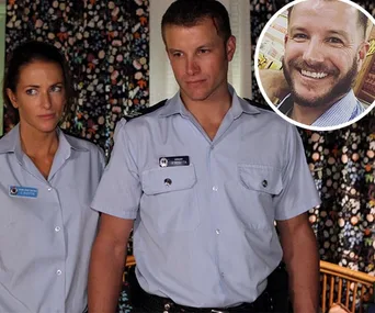 Two actors in police uniforms inside a room with patterned curtains; inset photo of a smiling man.