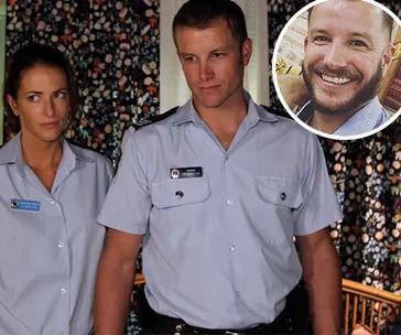 Two actors in police uniforms inside a room with patterned curtains; inset photo of a smiling man.