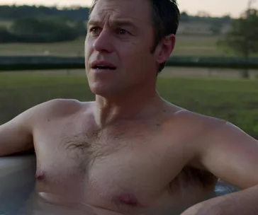 Man in a hot tub outdoors, looking concerned, from "Doctor Doctor" series scene.