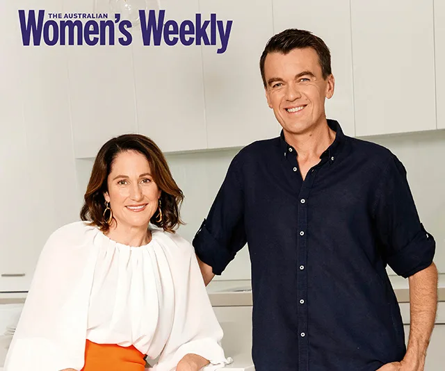 Man and woman smiling in kitchen, featured in The Australian Women's Weekly.