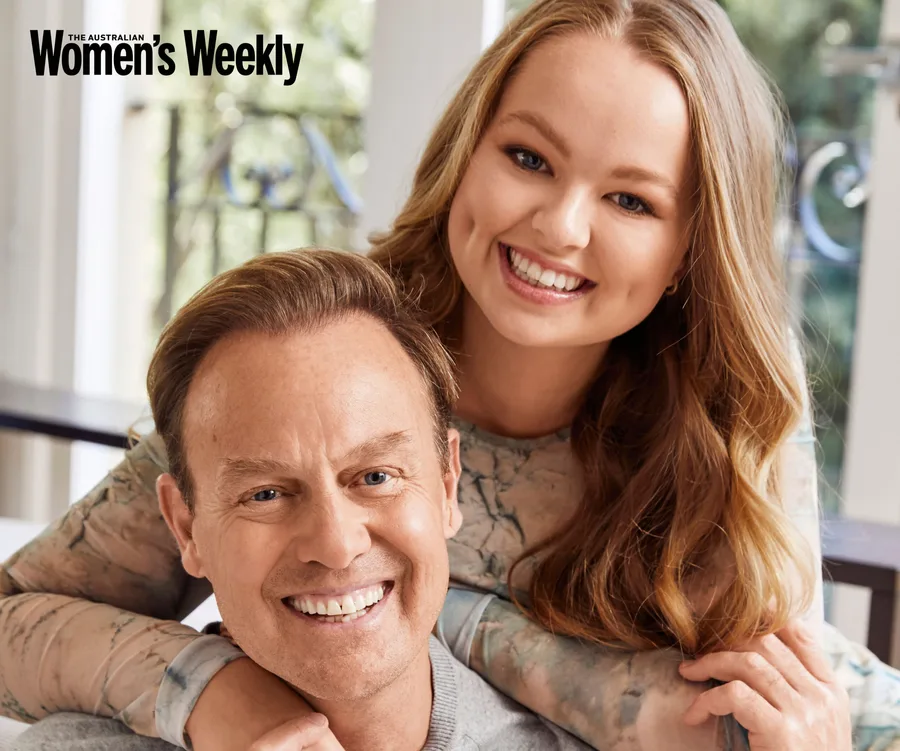 Man and woman smiling warmly indoors, featured in Australian Women's Weekly.