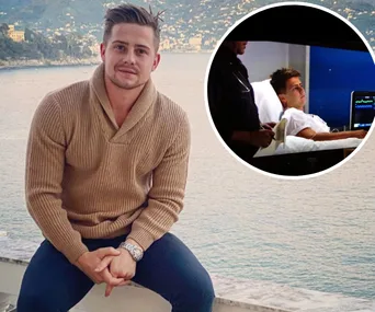 Man in a tan sweater poses by the water; inset shows him in a hospital bed scene.