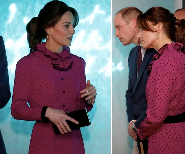 Kate Middleton in a pink polka dot dress, standing with Prince William, against a blue background.
